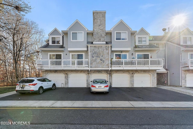 townhome / multi-family property featuring a garage