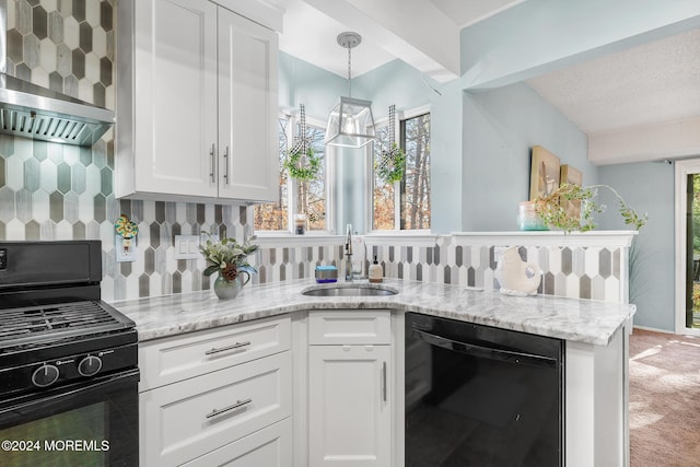 kitchen featuring light stone countertops, white cabinetry, sink, decorative backsplash, and black appliances