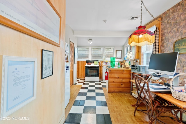 office space featuring wood walls and light parquet floors