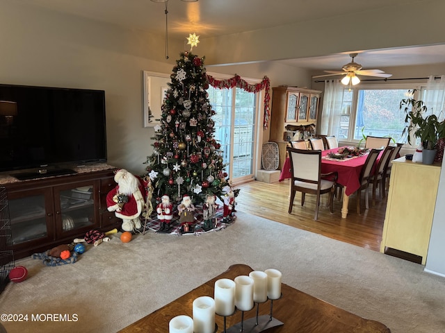 living room featuring ceiling fan and light carpet