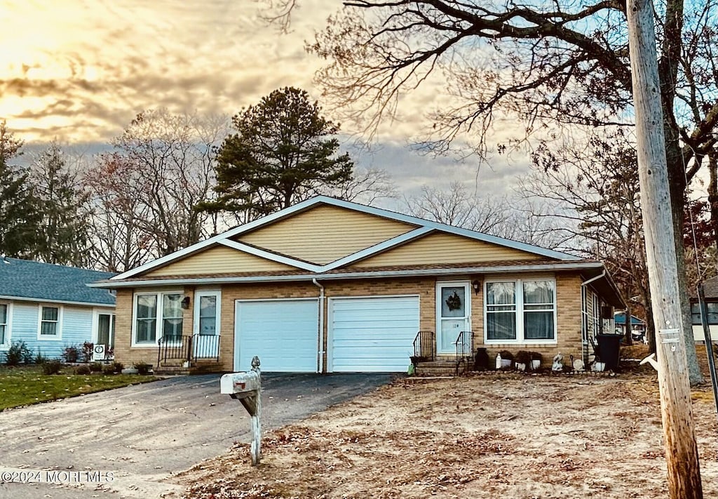 single story home with a garage