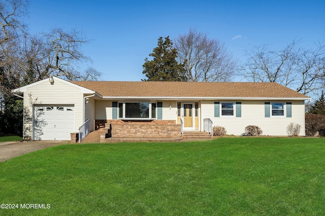 single story home featuring a garage and a front yard