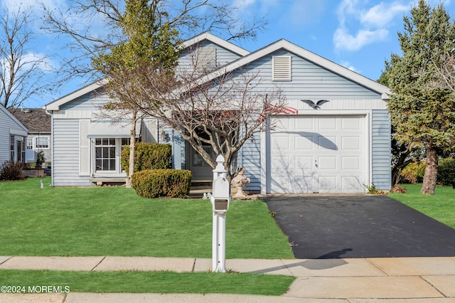 ranch-style house with a garage and a front lawn