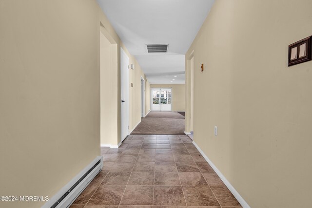 corridor featuring baseboard heating