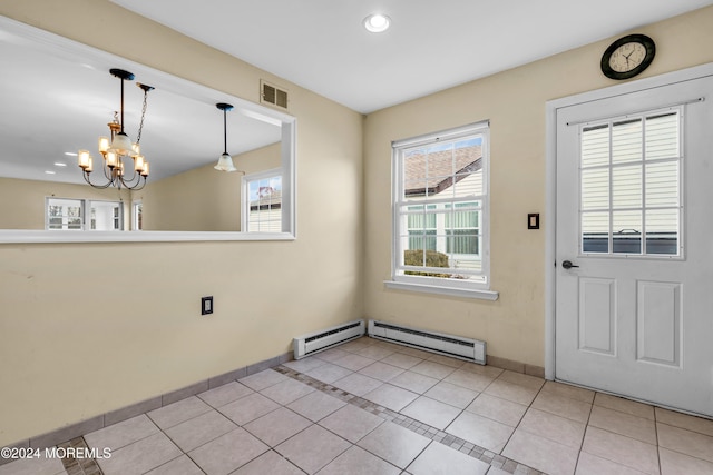 doorway featuring a chandelier, light tile patterned floors, and a baseboard heating unit