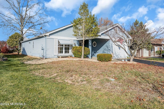 view of front of property with a garage and a front yard