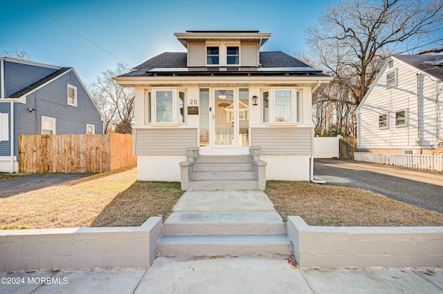 bungalow-style house featuring covered porch