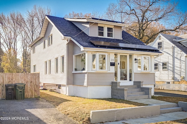 view of front of property with solar panels