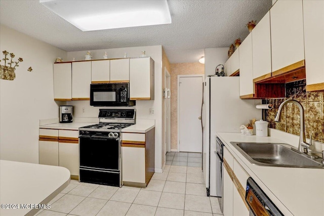 kitchen with white cabinets, dishwasher, stove, and sink