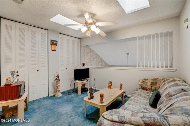 living room with carpet, ceiling fan, lofted ceiling, and a textured ceiling