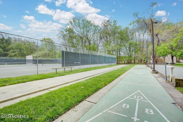 view of community with tennis court