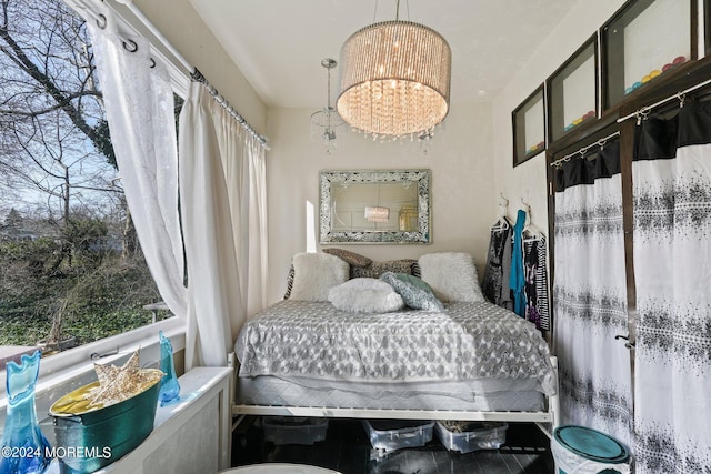 448 Monmouth Pl, Long Branch, NJ 07740 - bedroom featuring a chandelier