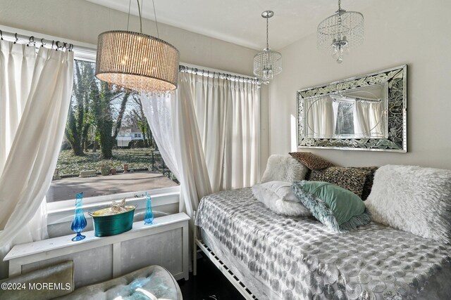 bedroom with an inviting chandelier