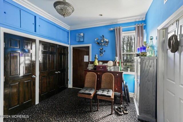 sitting room featuring crown molding