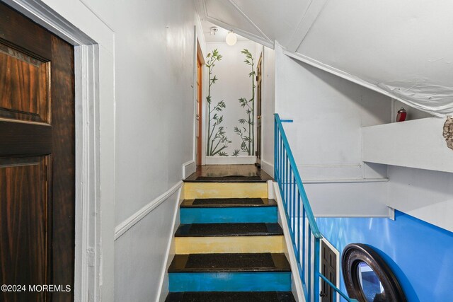 448 Monmouth Pl, Long Branch, NJ 07740 - stairway with baseboards and crown molding