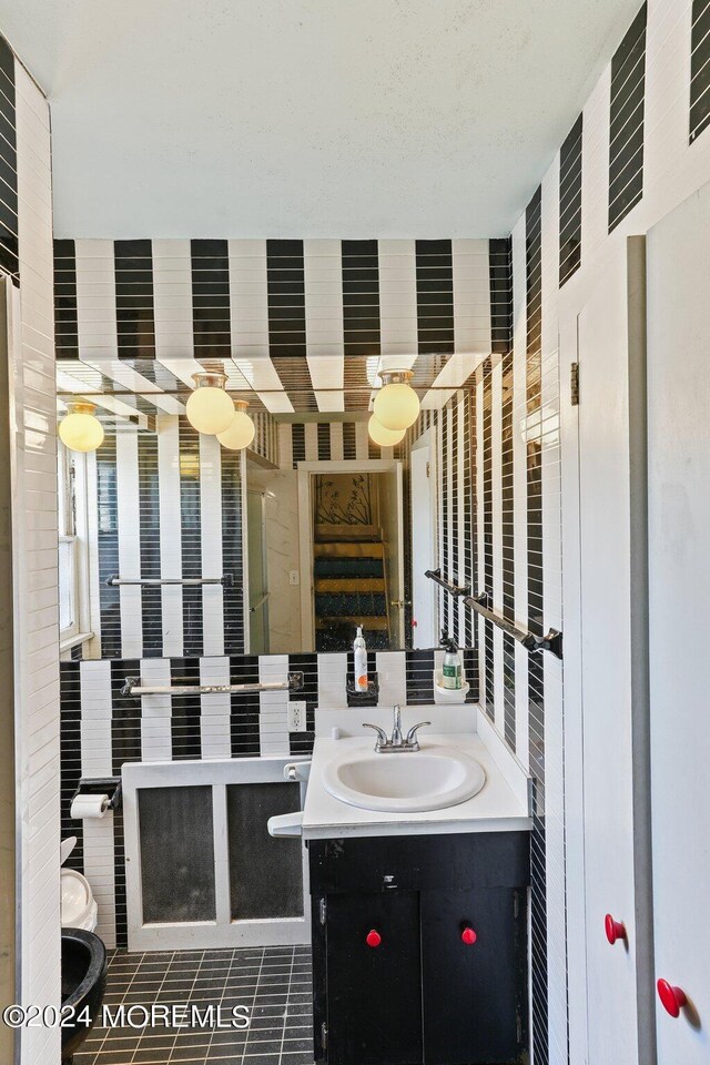 bathroom with tile patterned flooring and vanity