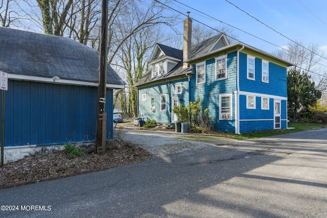 448 Monmouth Pl, Long Branch, NJ 07740 - view of side of home with a chimney
