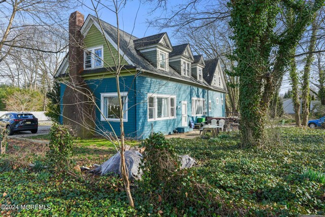 view of home's exterior with a patio area