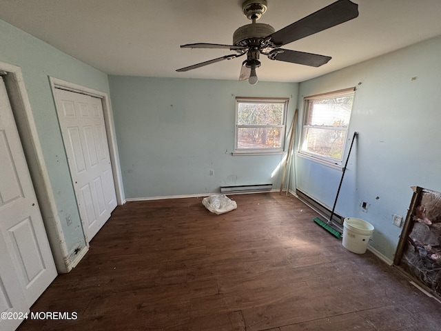 unfurnished bedroom with a closet, dark hardwood / wood-style flooring, a baseboard radiator, and ceiling fan