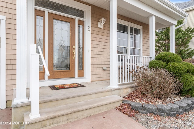 property entrance featuring a porch