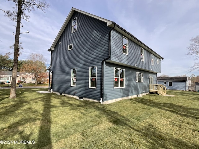 view of property exterior featuring a lawn