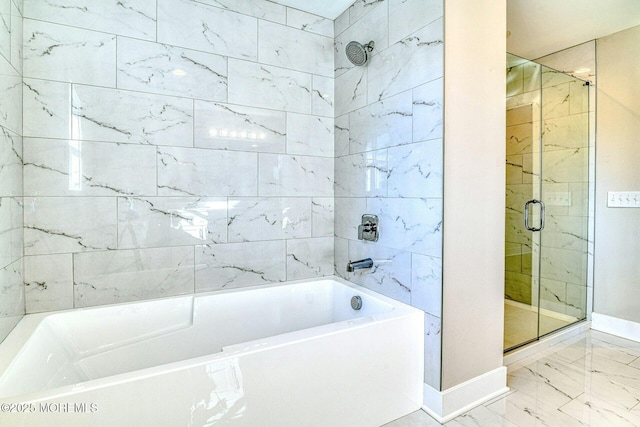 bathroom featuring separate shower and tub