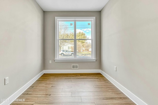 1032 3rd Ave, Toms River, NJ 08757 - unfurnished room featuring light wood finished floors and baseboards