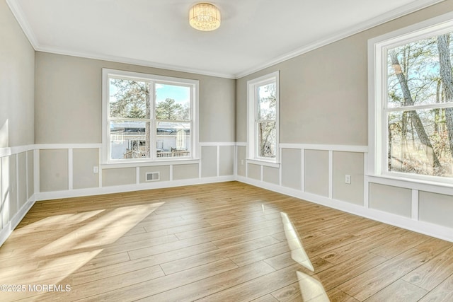 1032 3rd Ave, Toms River, NJ 08757 - spare room with wood finished floors, ornamental molding, and wainscoting