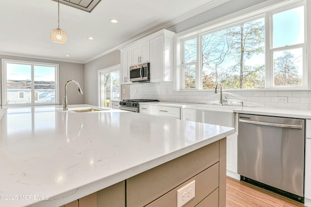 1032 3rd Ave, Toms River, NJ 08757 - kitchen with stainless steel appliances, crown molding, tasteful backsplash, recessed lighting, and white cabinetry