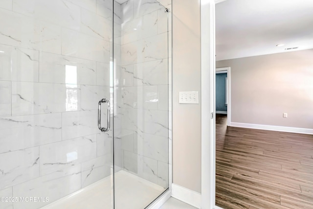 1032 3rd Ave, Toms River, NJ 08757 - bathroom featuring a stall shower and wood finished floors