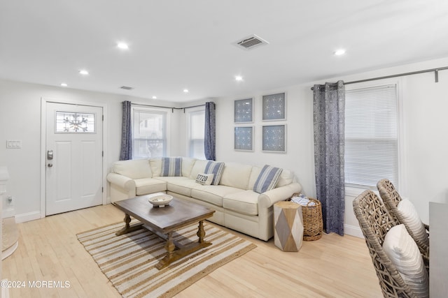 living room with light hardwood / wood-style flooring