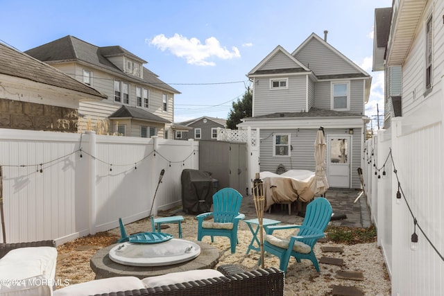 view of patio / terrace with area for grilling and an outdoor fire pit