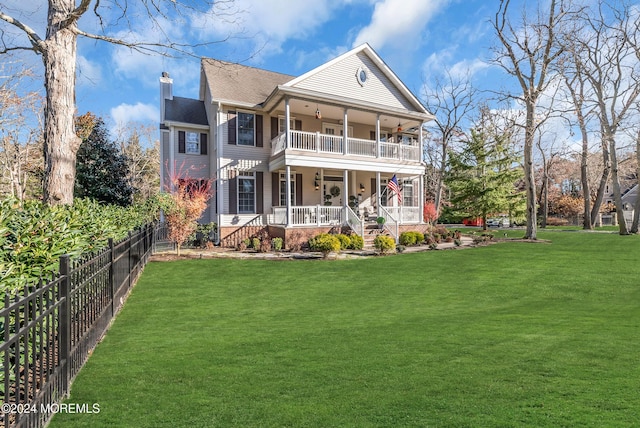 view of front of home with a porch and a front lawn