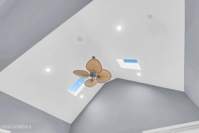 interior details with a skylight and ceiling fan