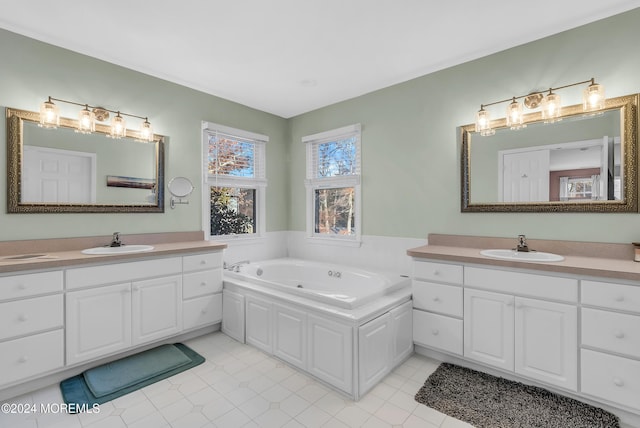 bathroom with tile patterned floors, vanity, and a bath