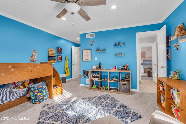 carpeted bedroom featuring ceiling fan, ornamental molding, and ensuite bathroom