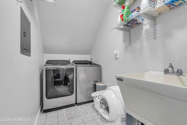 laundry room with separate washer and dryer, sink, light tile patterned floors, and electric panel