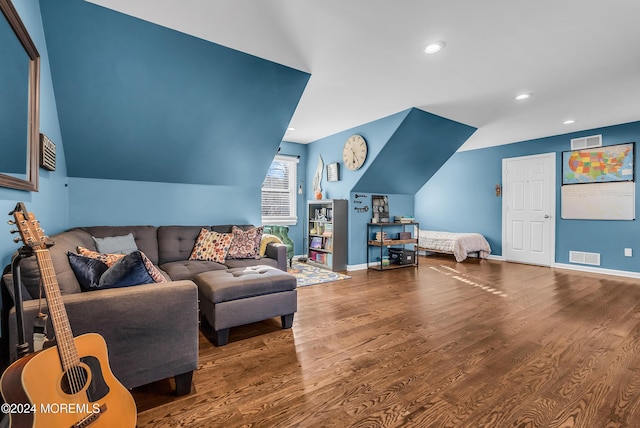 living room with wood-type flooring and vaulted ceiling