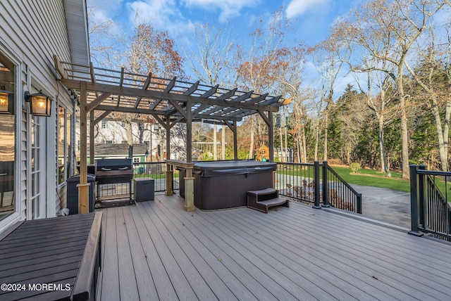 wooden deck with a pergola and a hot tub