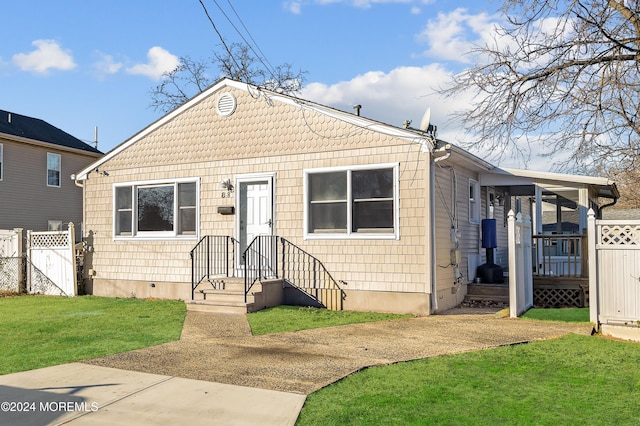 bungalow with a front yard