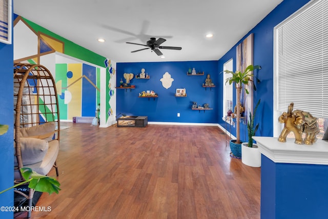 misc room featuring ceiling fan and wood-type flooring