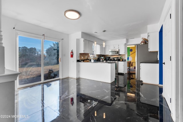 kitchen with white cabinets, backsplash, kitchen peninsula, and white electric stove