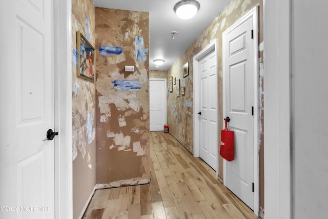 hall with light wood-type flooring