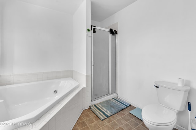 bathroom featuring toilet and shower with separate bathtub