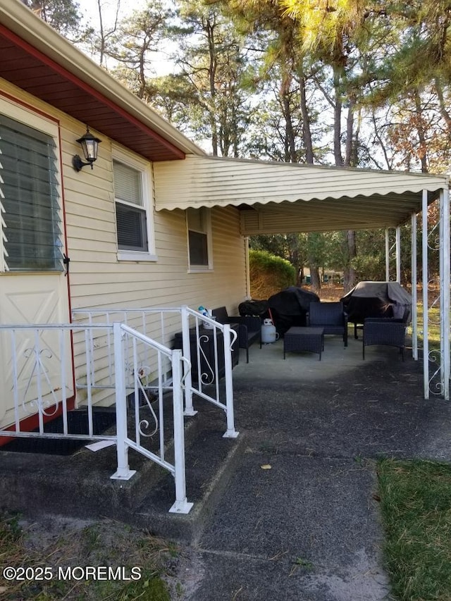 33 Penwood Dr Unit 55, Whiting, NJ 08759 - view of patio with a grill, a carport, and an outdoor living space