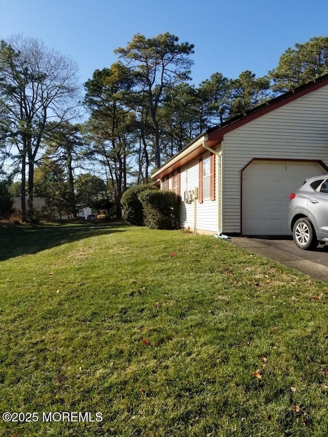 33 Penwood Dr Unit 55, Whiting, NJ 08759 - view of side of home featuring a garage, a yard, and driveway