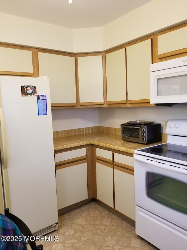33 Penwood Dr Unit 55, Whiting, NJ 08759 - kitchen featuring white appliances and light countertops