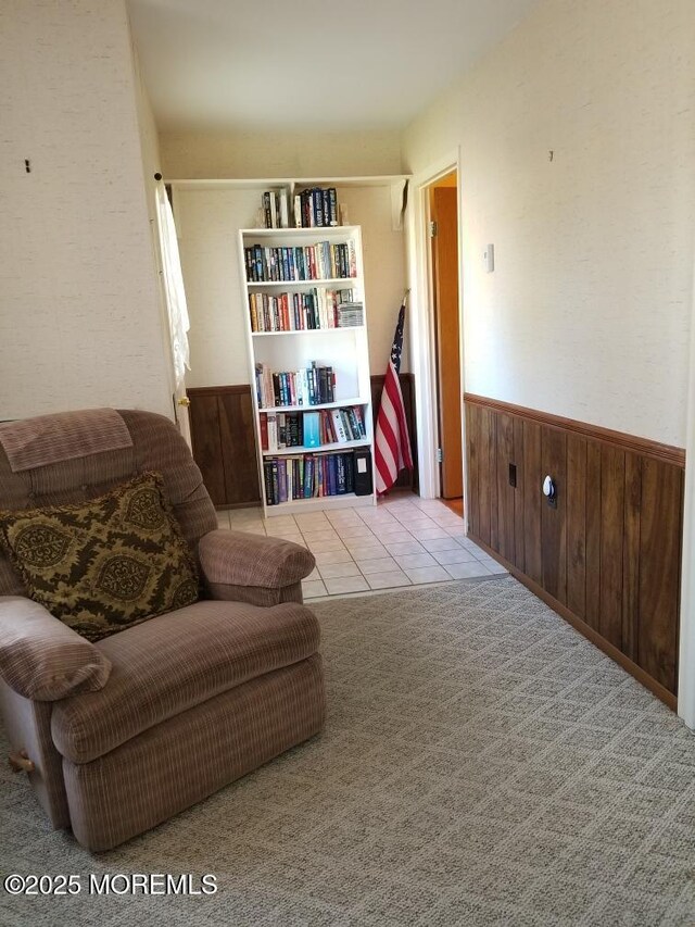 33 Penwood Dr Unit 55, Whiting, NJ 08759 - sitting room featuring wainscoting, carpet floors, wooden walls, and tile patterned floors