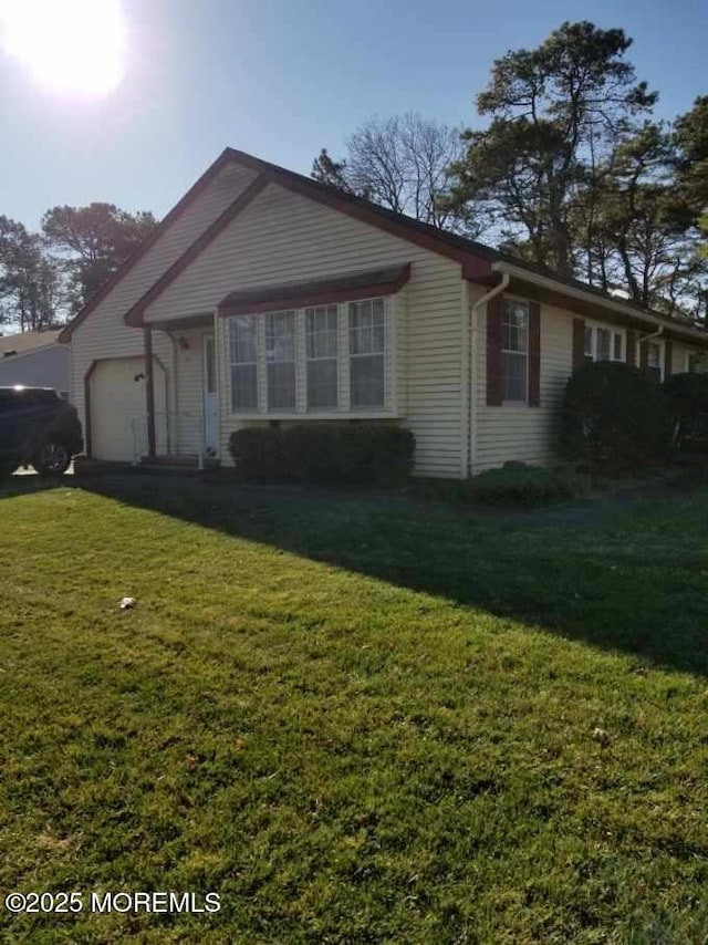 33 Penwood Dr Unit 55, Whiting, NJ 08759 - view of front of home with a garage and a front lawn