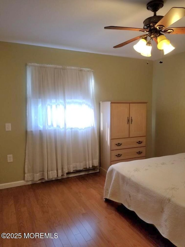 33 Penwood Dr Unit 55, Whiting, NJ 08759 - bedroom featuring wood finished floors, a ceiling fan, and baseboards